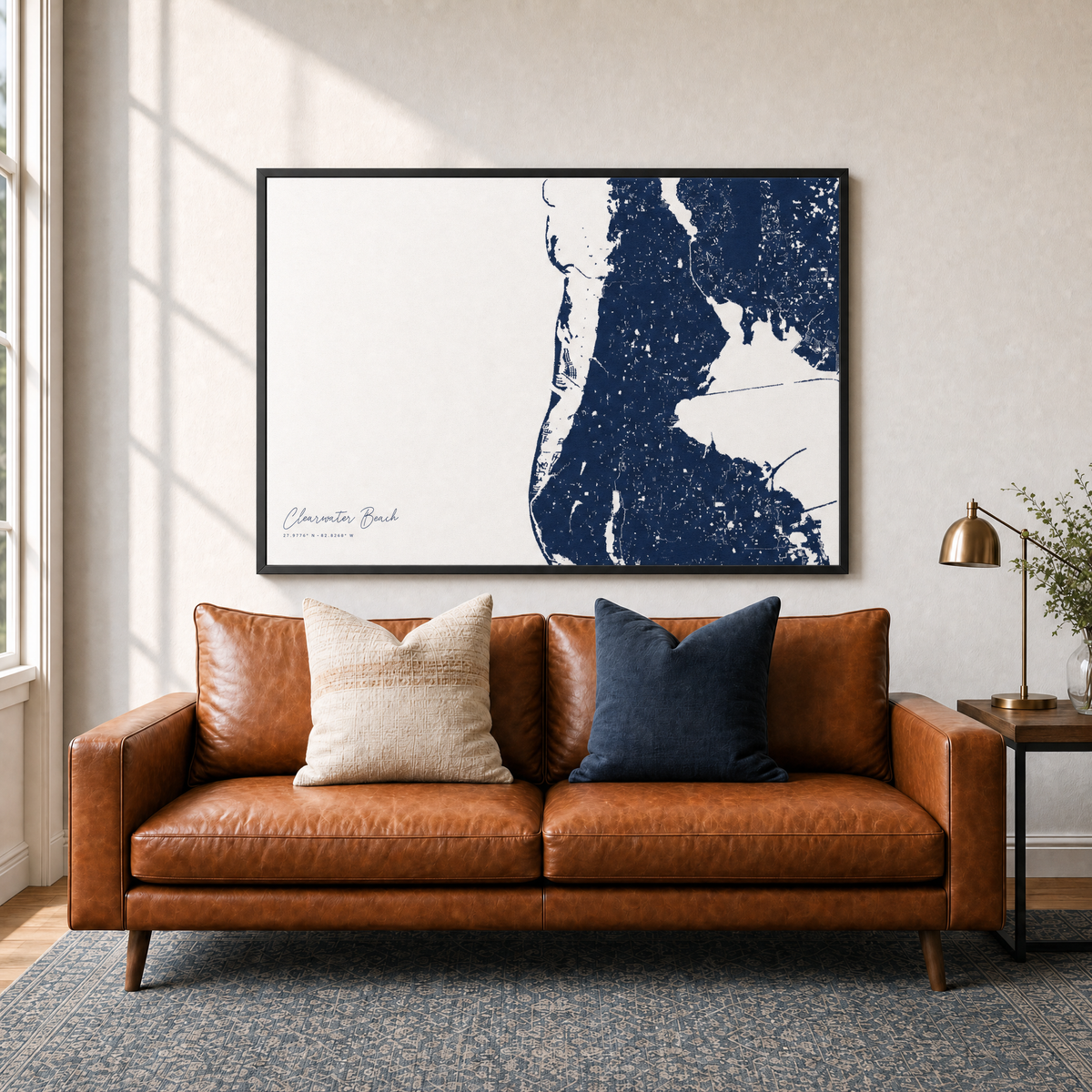 Clearwater Beach canvas map — two-pillow black-frame sofa interior