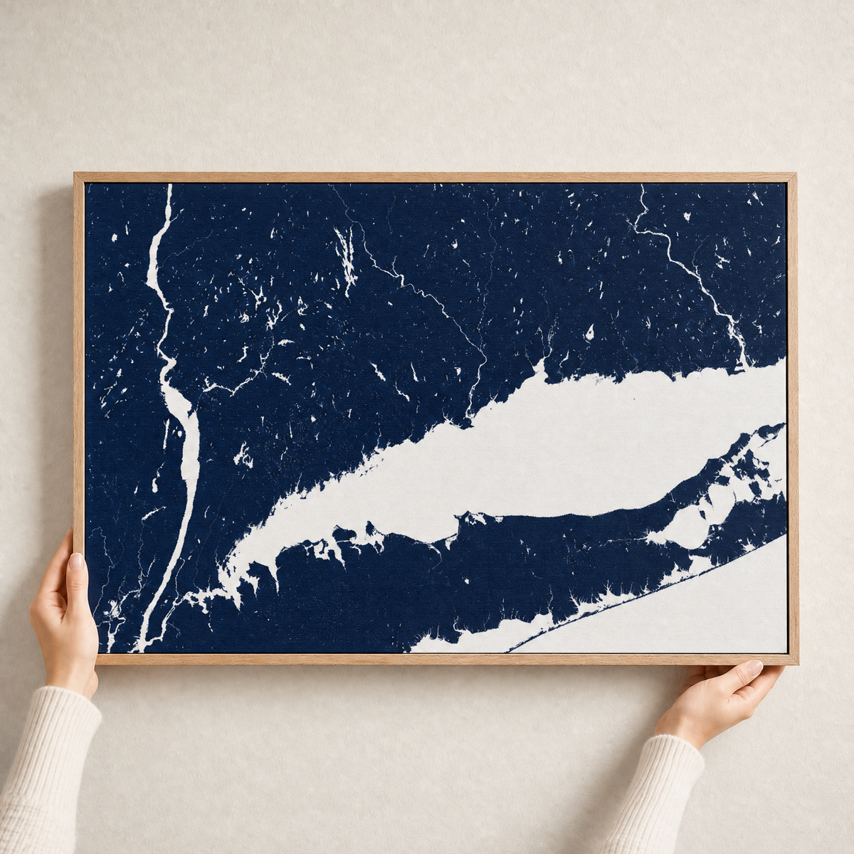 Connecticut Coast canvas map — hands holding the canvas in an oak frame