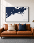 Crystal Coast / Emerald Isle canvas map — two-pillow black-frame sofa interior
