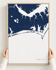 Crystal Coast / Emerald Isle canvas map — hands holding the canvas in an oak frame