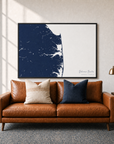 Delaware Beaches canvas map — two-pillow black-frame sofa interior