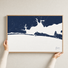 Destin canvas map — hands holding the canvas in an oak frame