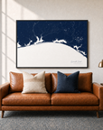 Emerald Coast canvas map — two-pillow black-frame sofa interior