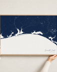 Emerald Coast canvas map — hands holding the canvas in an oak frame