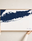 Fire Island canvas map — hands holding the canvas in an oak frame