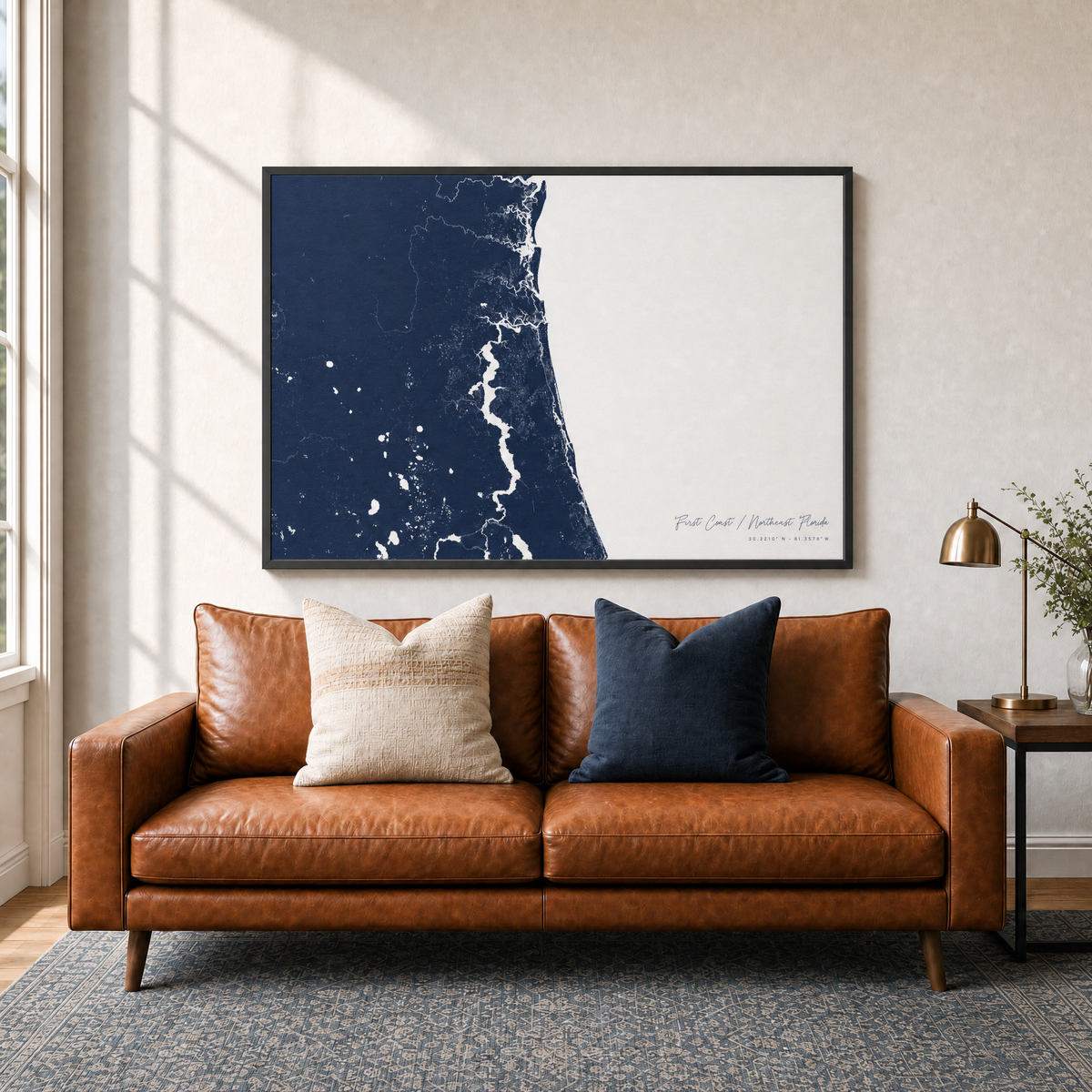 First Coast / Northeast Florida canvas map — two-pillow black-frame sofa interior