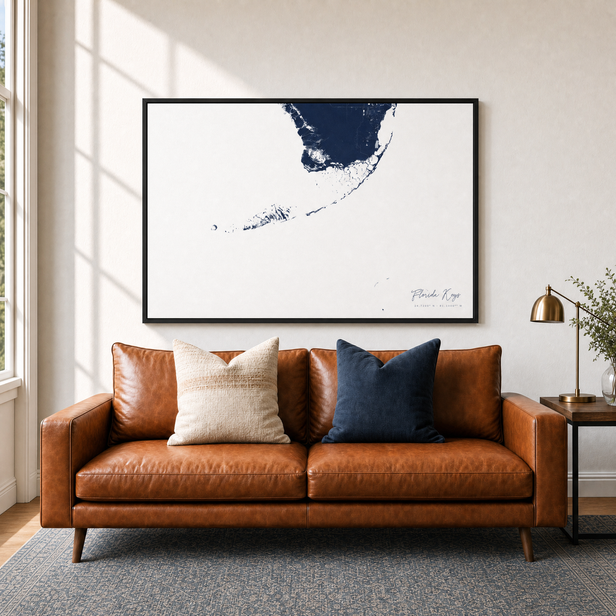 Florida Keys canvas map — two-pillow black-frame sofa interior