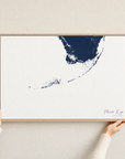 Florida Keys canvas map — hands holding the canvas in an oak frame