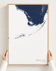 Florida Keys canvas map — hands holding the canvas in an oak frame
