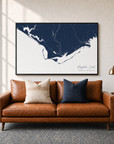 Forgotten Coast canvas map — two-pillow black-frame sofa interior