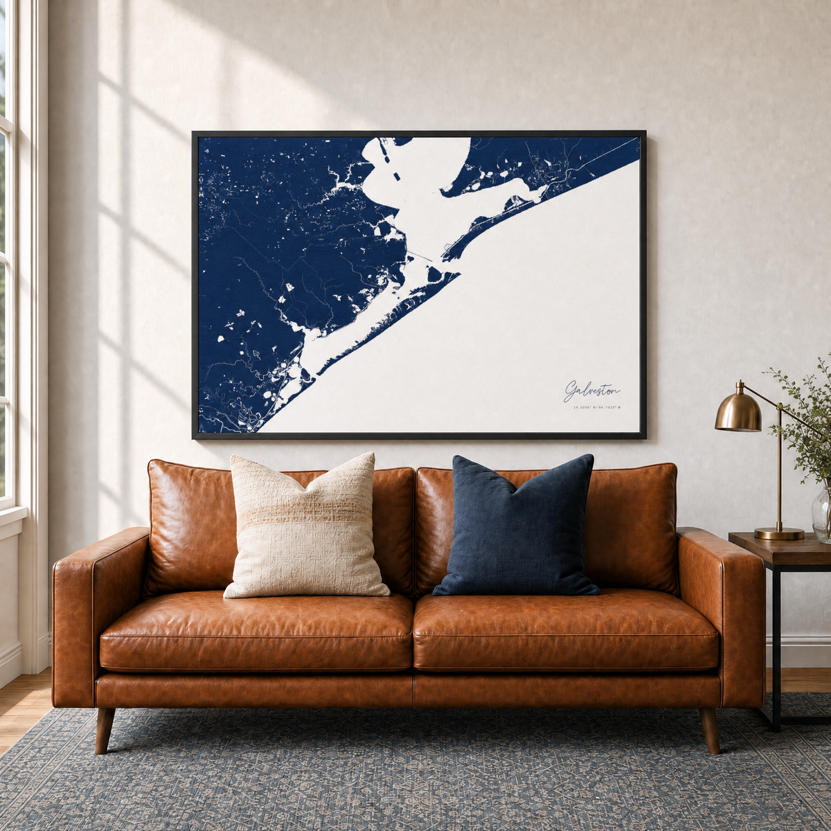 Galveston canvas map — two-pillow black-frame sofa interior