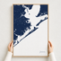 Galveston canvas map — hands holding the canvas in an oak frame