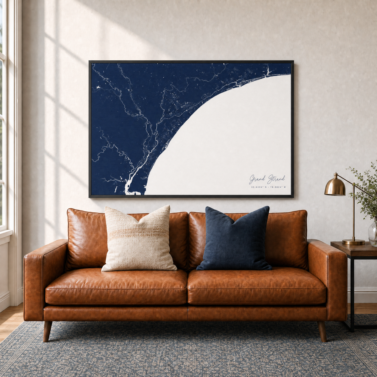 Grand Strand canvas map — two-pillow black-frame sofa interior