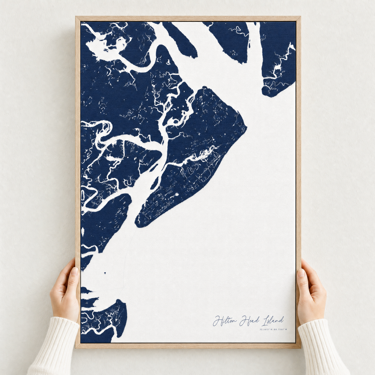 Hilton Head Island canvas map — hands holding the canvas in an oak frame