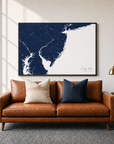 Jersey Shore canvas map — two-pillow black-frame sofa interior