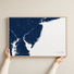 Jersey Shore canvas map — hands holding the canvas in an oak frame