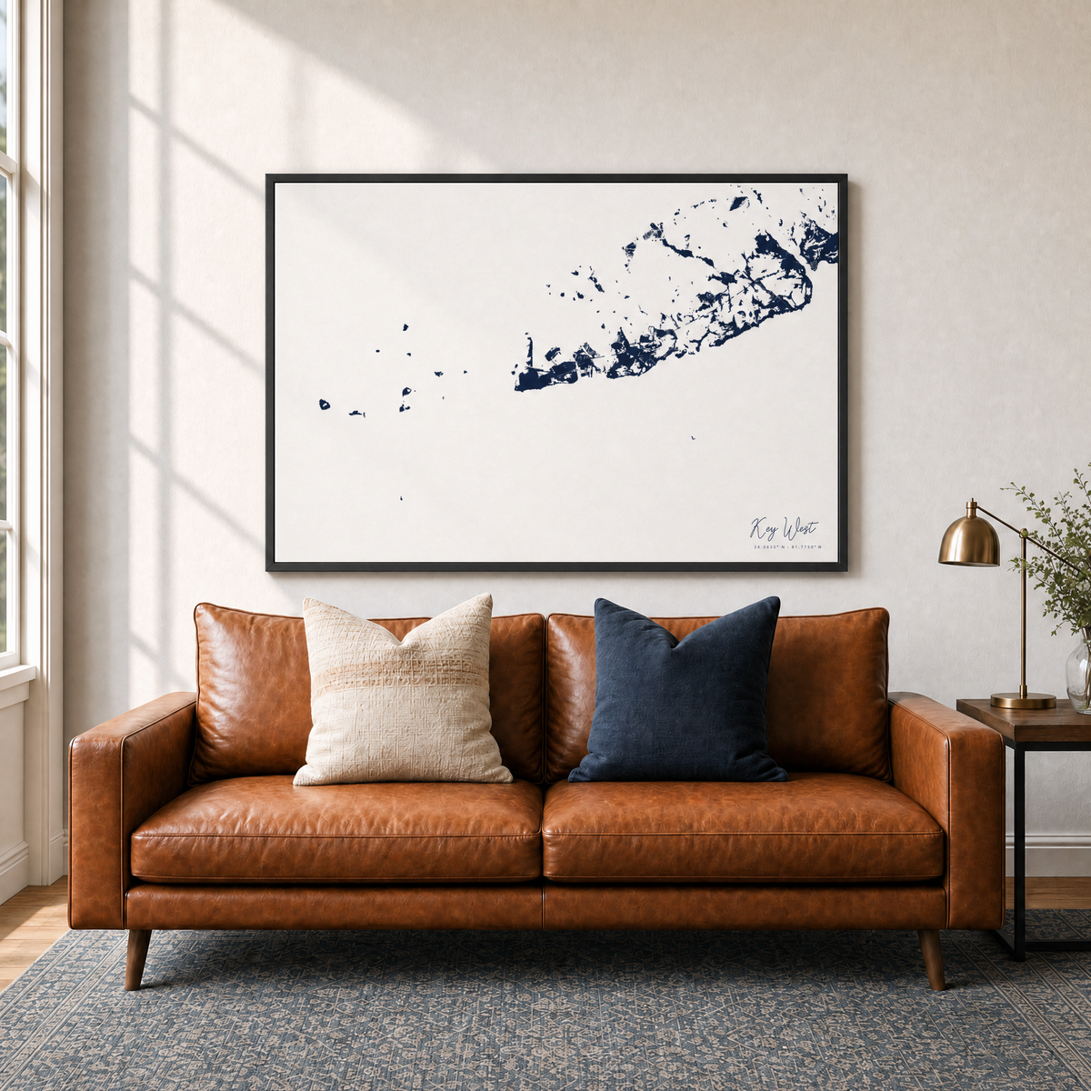 Key West canvas map — two-pillow black-frame sofa interior