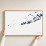 Key West canvas map — hands holding the canvas in an oak frame