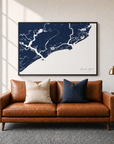 Kiawah Island canvas map — two-pillow black-frame sofa interior