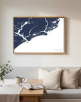 Kiawah Island navy horizontal canvas map in an oak framed room scene
