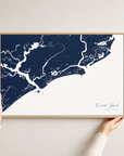 Kiawah Island canvas map — hands holding the canvas in an oak frame