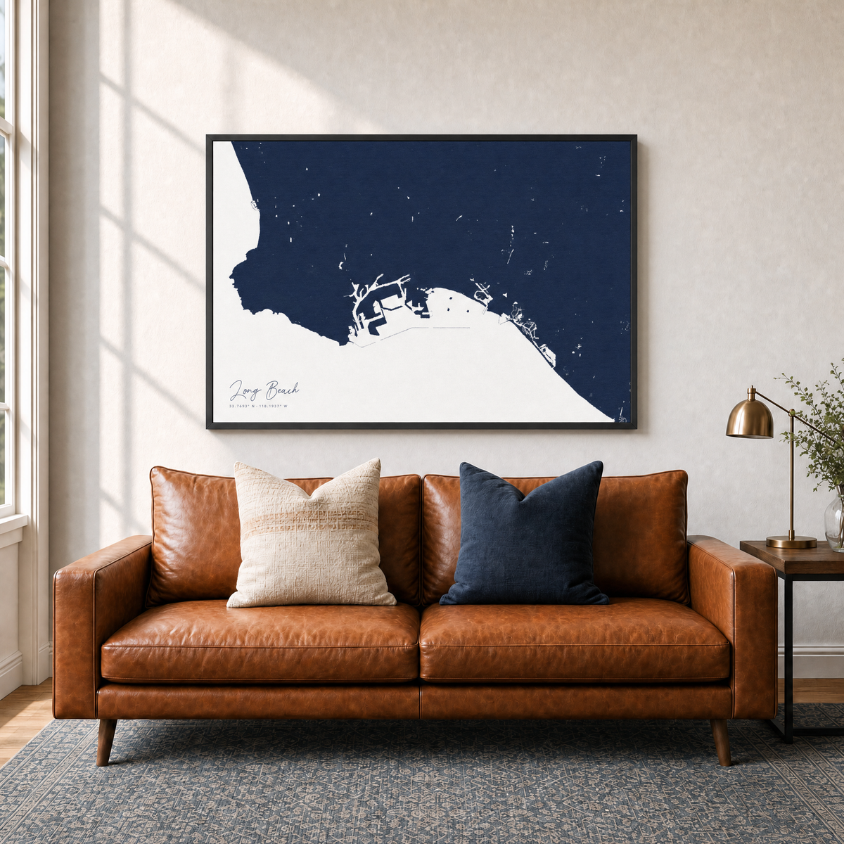 Long Beach canvas map — two-pillow black-frame sofa interior