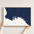 Long Beach canvas map — hands holding the canvas in an oak frame