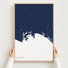 Long Beach canvas map — hands holding the canvas in an oak frame