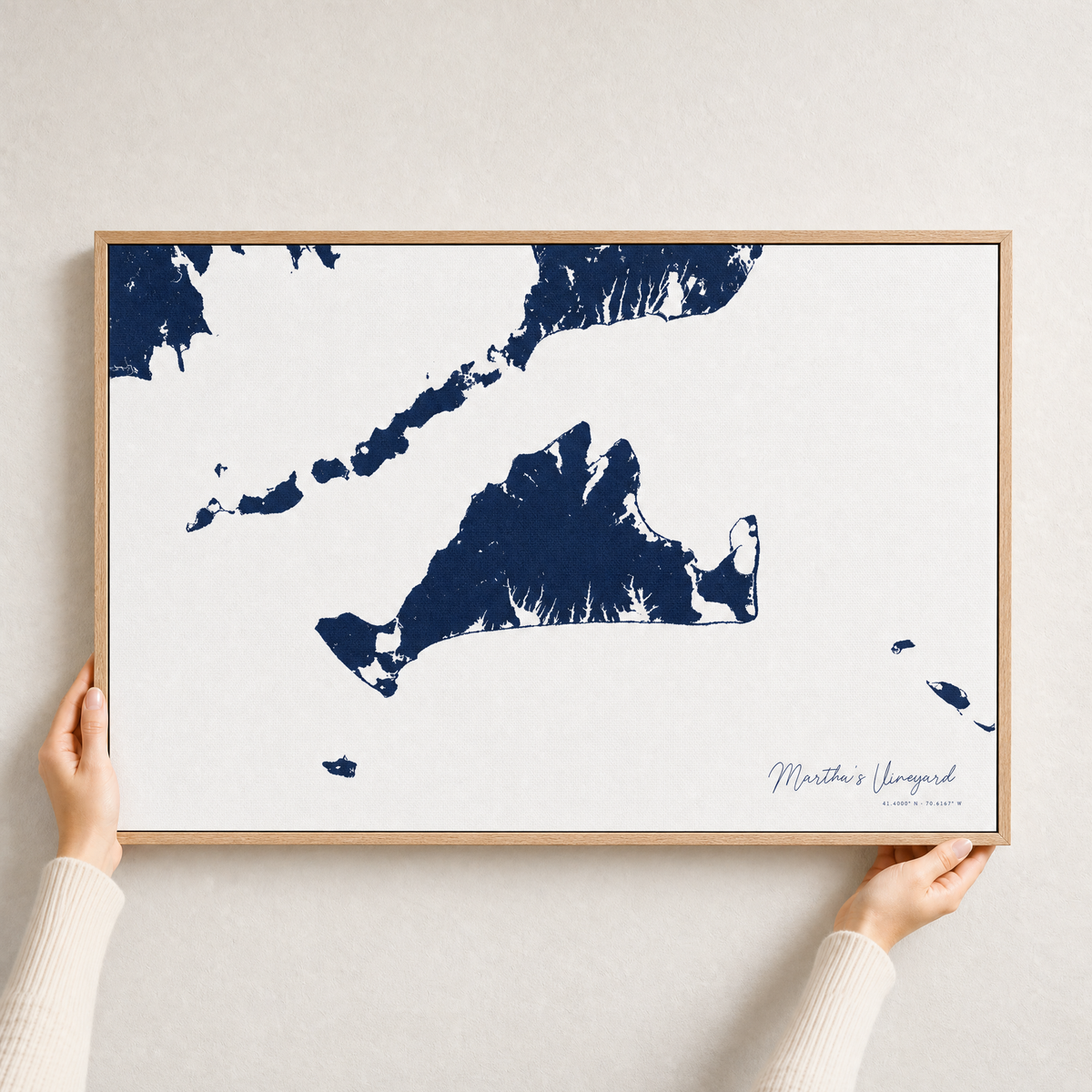 Martha's Vineyard canvas map — hands holding the canvas in an oak frame