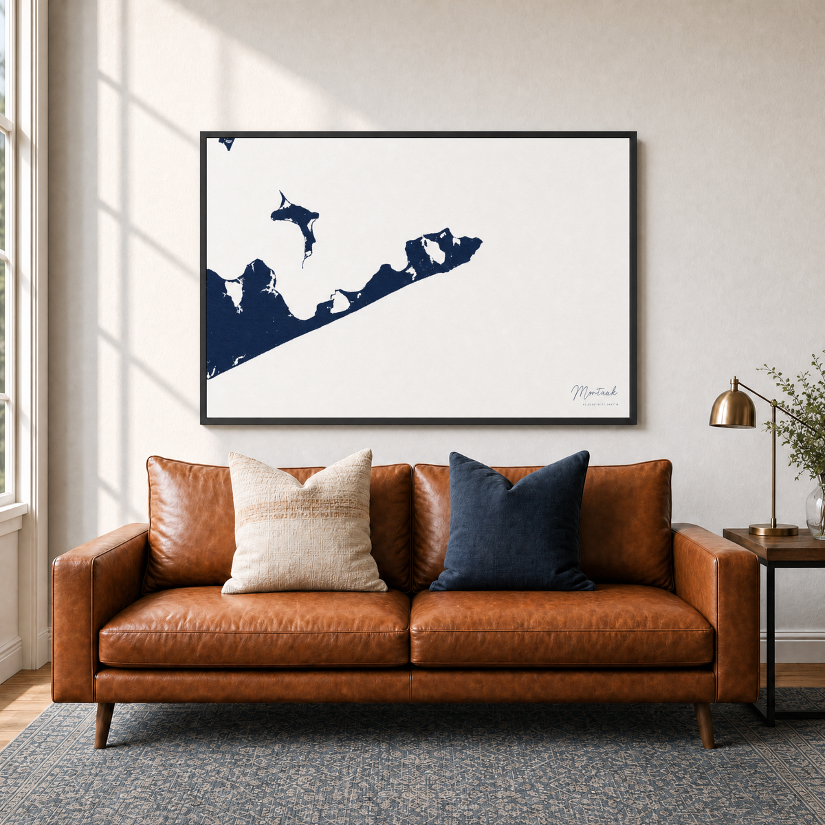 Montauk canvas map — two-pillow black-frame sofa interior