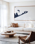 Montauk navy horizontal canvas map in an oak framed room scene