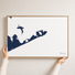 Montauk canvas map — hands holding the canvas in an oak frame