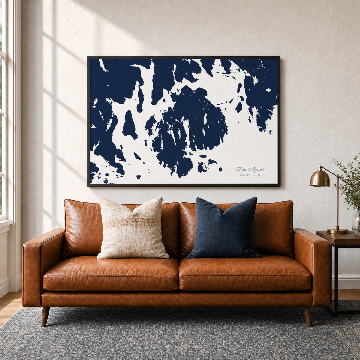 Mount Desert canvas map — two-pillow black-frame sofa interior