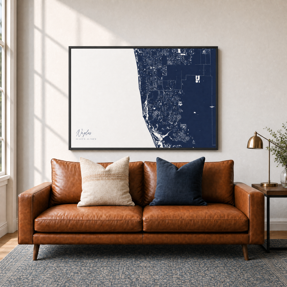 Naples canvas map — two-pillow black-frame sofa interior