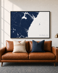 New Hampshire Coast canvas map — two-pillow black-frame sofa interior