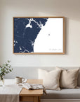 New Hampshire Coast navy horizontal canvas map in an oak framed room scene