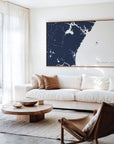 New Hampshire Coast navy horizontal canvas map in an oak framed room scene