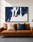 Newport canvas map — two-pillow black-frame sofa interior