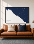 Newport Beach canvas map — two-pillow black-frame sofa interior