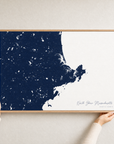 North Shore Massachusetts canvas map — hands holding the canvas in an oak frame