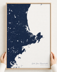 North Shore Massachusetts canvas map — hands holding the canvas in an oak frame
