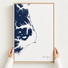 Outer Banks canvas map — hands holding the canvas in an oak frame