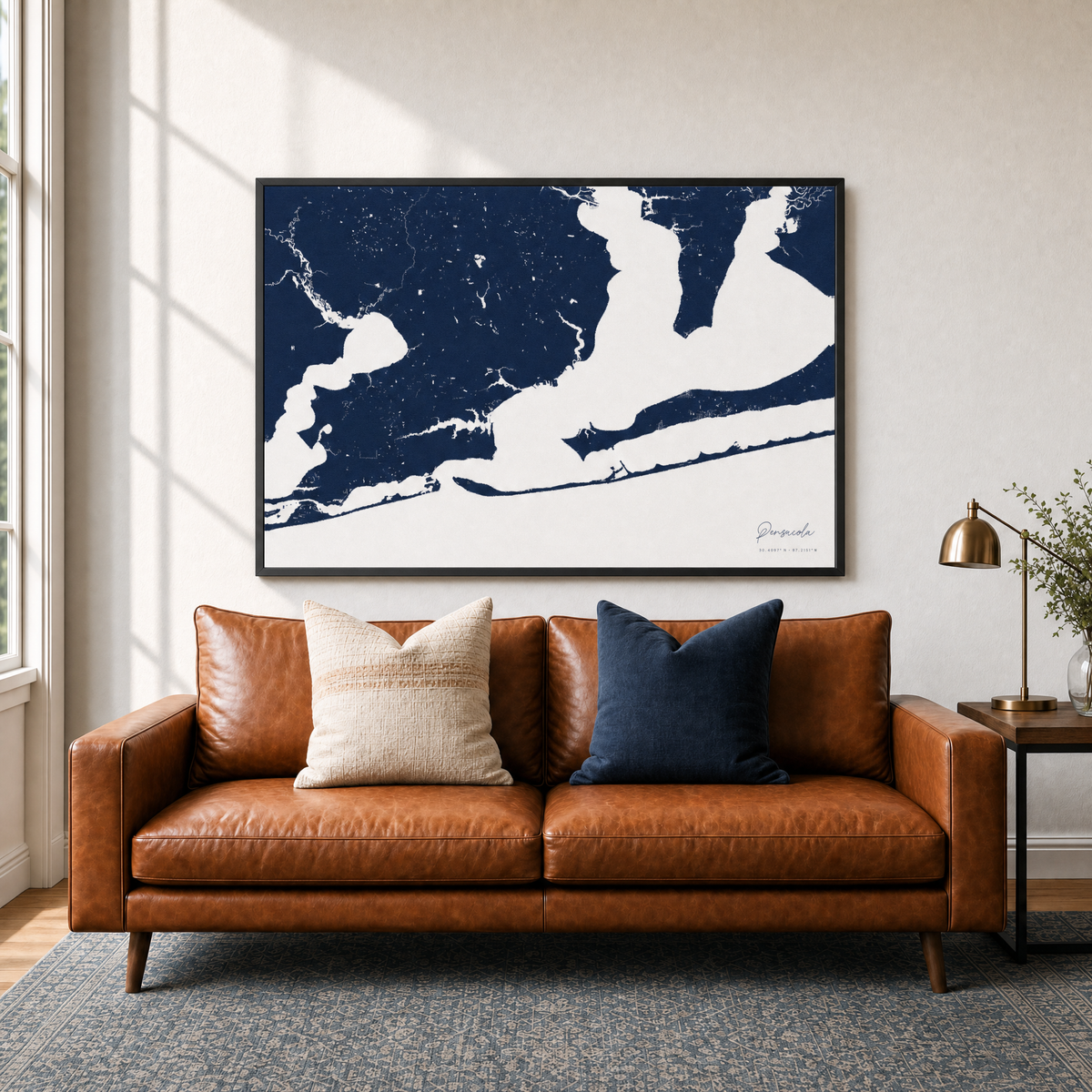 Pensacola canvas map — two-pillow black-frame sofa interior