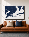 Pensacola canvas map — two-pillow black-frame sofa interior