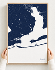 Pensacola canvas map — hands holding the canvas in an oak frame