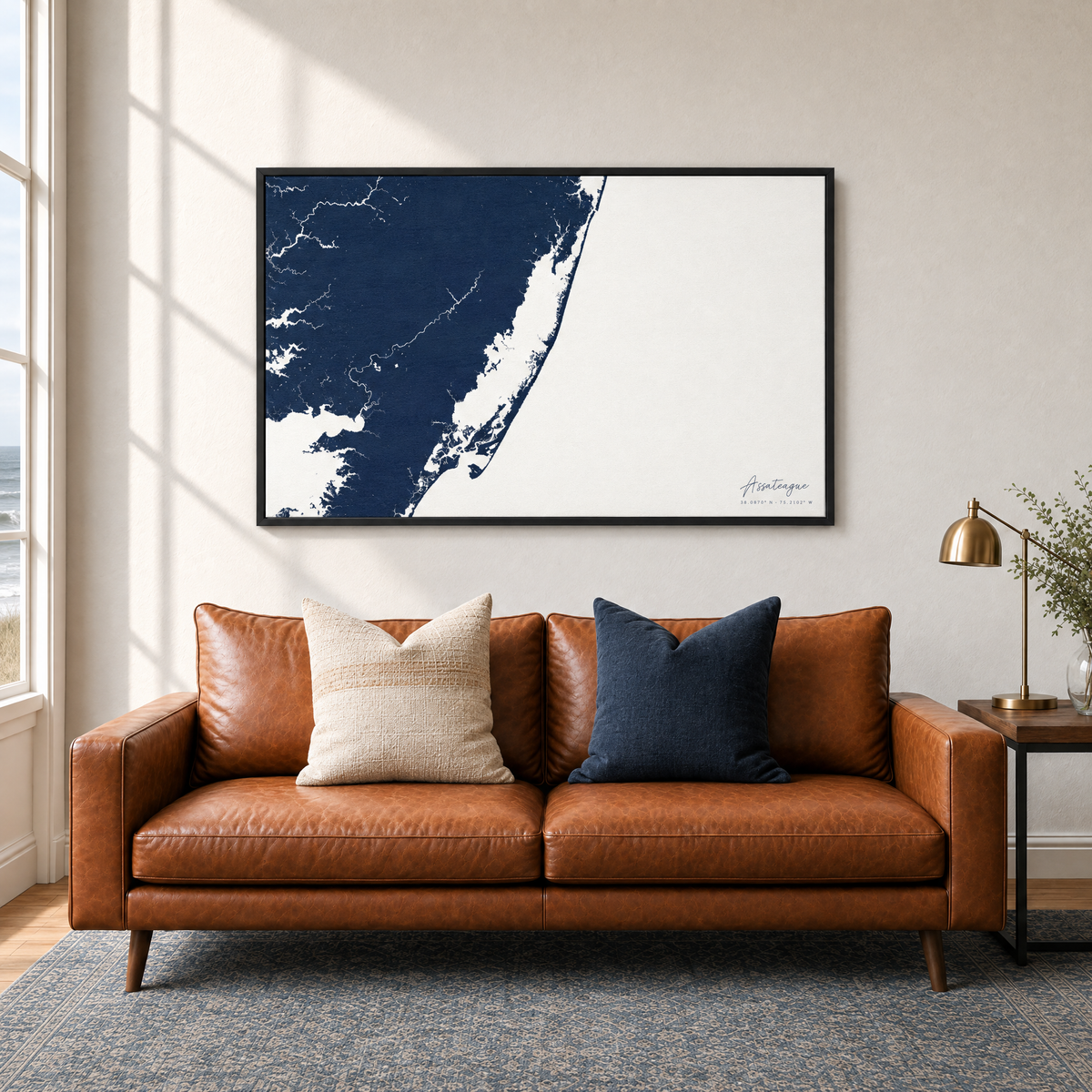 Assateague horizontal canvas map in Navy, black-framed canvas above a sofa