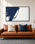 Assateague horizontal canvas map in Navy, black-framed canvas above a sofa