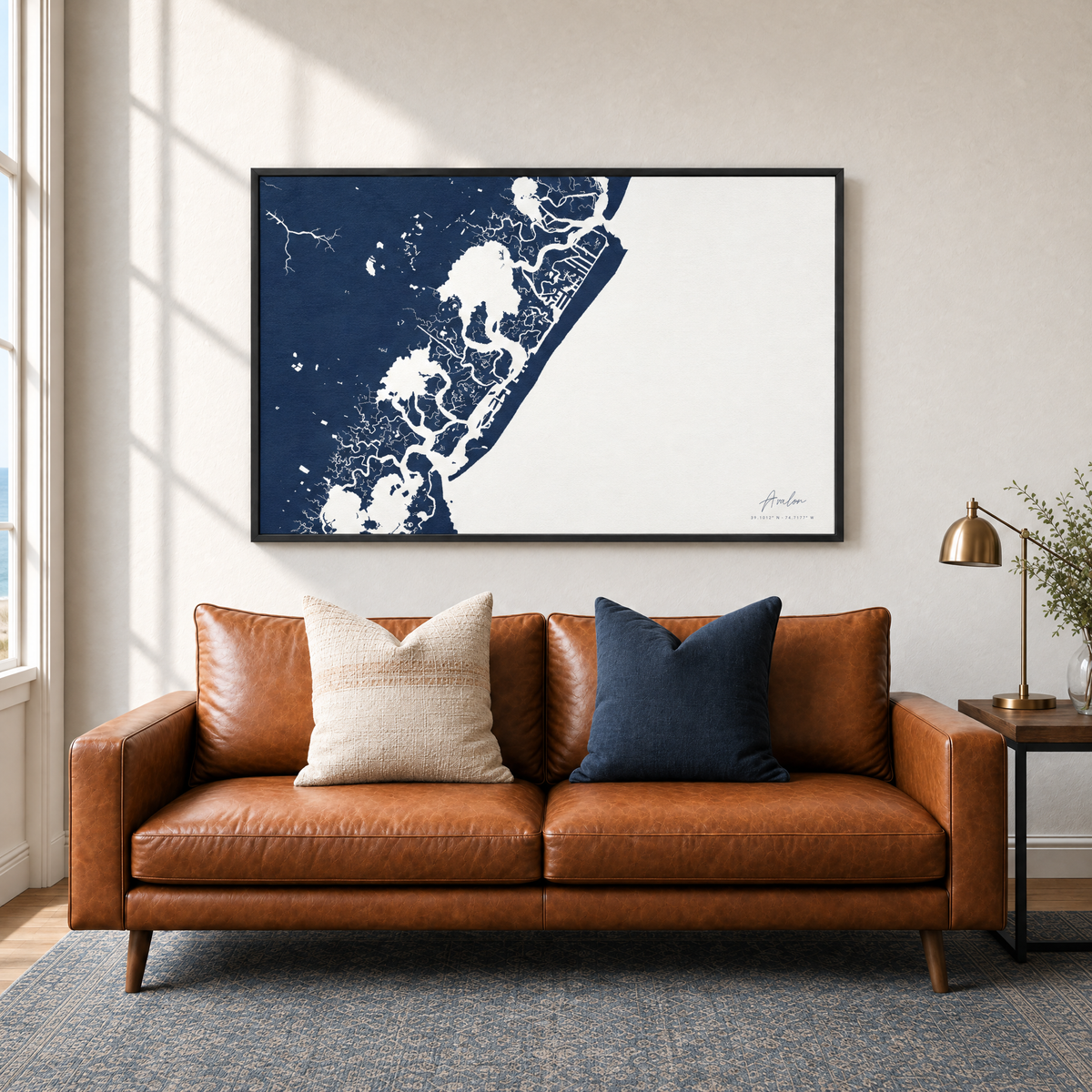 Avalon horizontal canvas map in Navy, black-framed canvas above a sofa