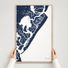 Avalon vertical canvas map in Navy, hands holding an oak-framed canvas