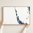 Captiva horizontal canvas map in Navy, hands holding an oak-framed canvas